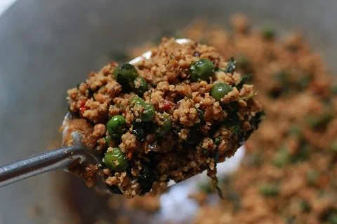A close up of a side dish with stir-fried leunca and oncom Stock Photos