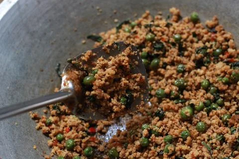 A close up of a side dish with stir-fried leunca and oncom Stock Photos
