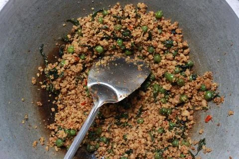 A close up of a side dish with stir-fried leunca and oncom Stock Photos