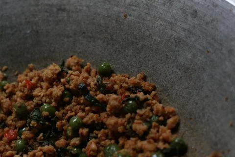A close up of a side dish with stir-fried leunca and oncom Stock Photos