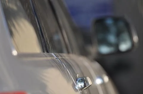 Close up of the side of a gray car Stock Photos