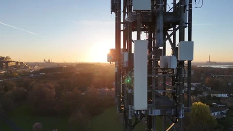 Close side pass of telecom mast at sunrise Stock Footage 331206962