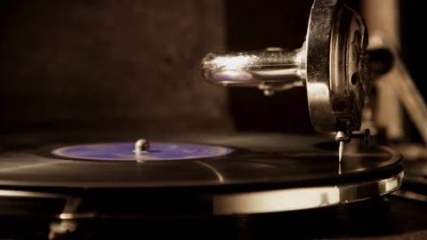 Close up side profile of antique gramophone playing record Stock Footage 329559679