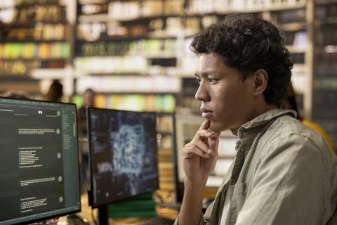 Close-up side profile of learner studying AI chatbot screen on desktop Stock Photos