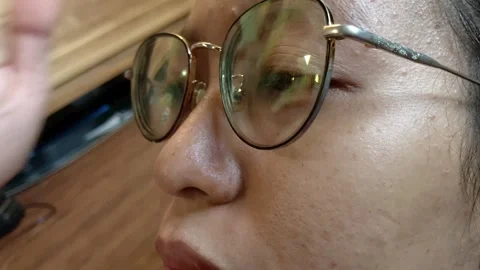 Close Up Side Profile Of Person Wearing Gold Rimmed Eyeglasses Vídeo Stock 338086444