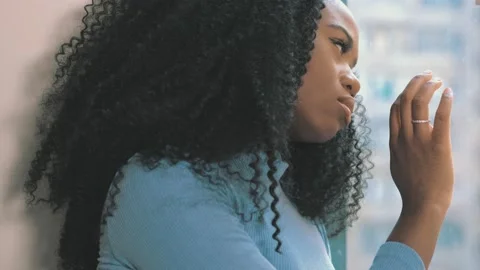 Close up side profile view of sad young african woman thinking of relationships  Stock Footage 170718028