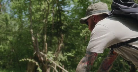 Close side-rear view of cyclist riding in forest Stock Footage 311919933