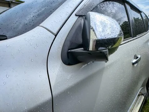 Close up side rear-view mirror on a modern car Stock Photos