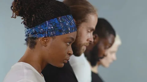 Close up side shot of group of people of different races raise head black white Video stock 133641397