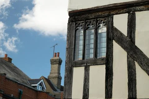 Close up side of Tudor timber framed cottage house with tall windows at Saffr 스톡 사진