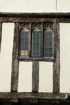 Close up side of Tudor timber framed cottage house with tall windows at Saffr Foto stock