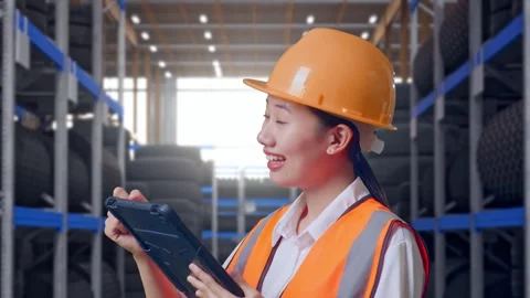 Close Up Side View Of Asian Female Engineer Taking Note On The Tablet Tire Stock Footage 341788716