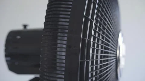 Close up side view of a black plastic electric fan structure and motor housing Stock Footage 346644936