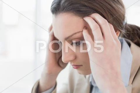 Close up side view of businesswoman suffering from headache Stock Photos