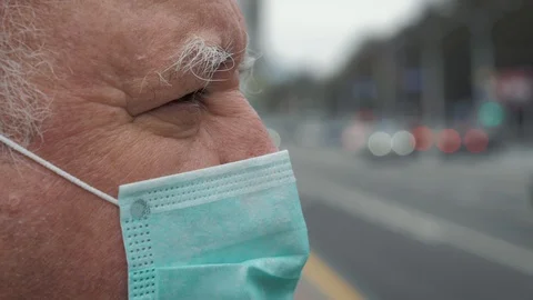 Close Up Side View Of Caucasian Elderly Man In Virus Proof Mask Near The Road Stock Footage 129841312