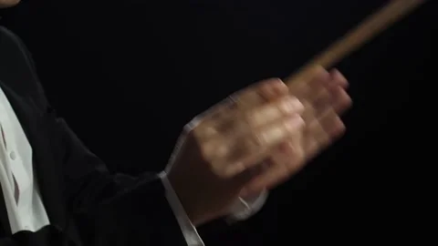 Close Up Side View Of Conductor'S Hands Holding A Baton And Moving Stock Footage 196958463