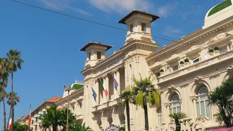 Close up side view to the facade of Sanremo Casino with flags of Italy. Stock Footage 94024477
