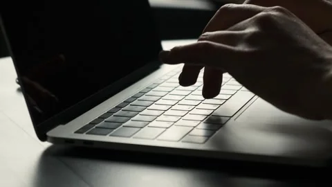 Close up side view of female hands typing on a laptop keyboard Stock Footage 240323982