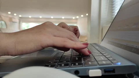 Close up side view of female hands of typing keyboard on laptop 動画素材 270191030