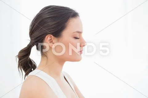 Close up side view of a fit young woman with eyes closed Stock Photos