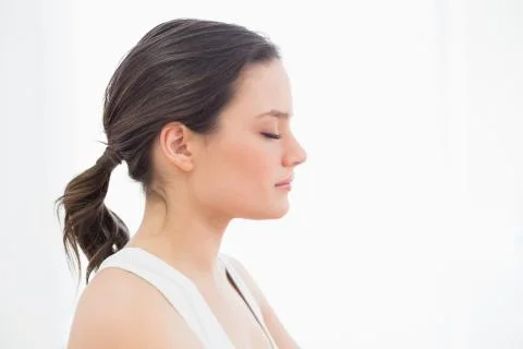 Close up side view of a fit young woman with eyes closed Stock Photos