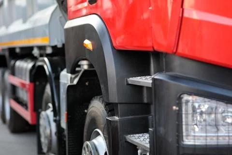 Close-up side view of a four axle dump truck Stock Photos