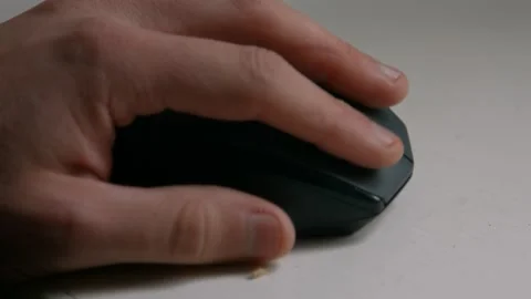 Close Up Side View of Hand Clicking and Scrolling on PC Computer Mouse on Stock Footage 242986495