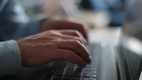 Close-up side view hands of unrecognizable mature adult male using typing on 스톡 동영상 195010846