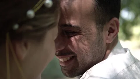 Close-up Side View of Happy Couple Smiling and Looking with Love at Each Other Stock Footage 143937982