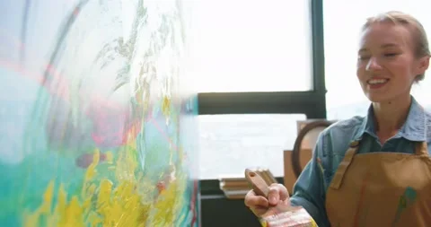 Close up. Side view of happy positive Caucasian young woman painter emotionally Stock Footage 149577469