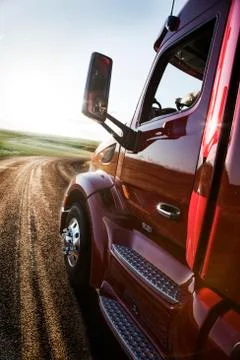 Close up side view looking forward of a  commercial truck on a highway at Stock Photos