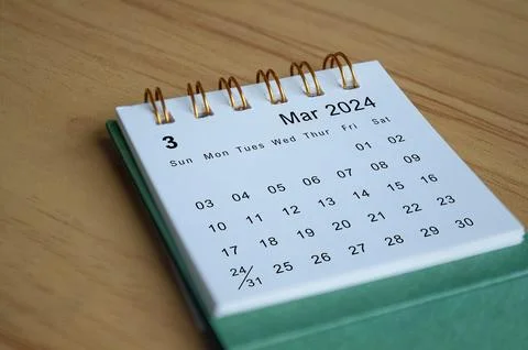 Close up side view of March 2024 calendar on wooden desk. Calendar concept Stock Photos
