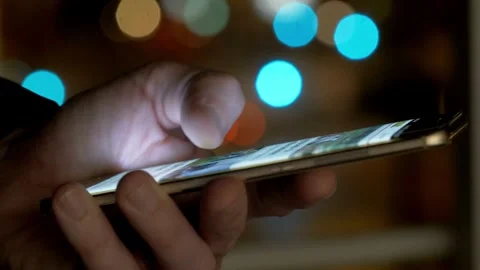 Close up side view millennial man holding cellphone in social media network.. Stock Footage 272780189