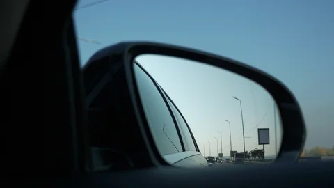 Close-up Side-view mirror Reflection Car Moving Behind Following on Highway. Bri Stock Footage 106188884