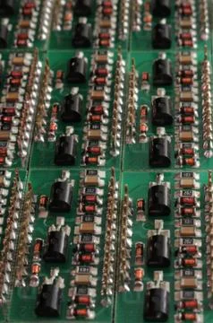 Close-up side view of a PCB board with SMD components Фото