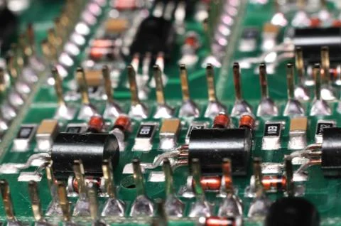 Close-up side view of a PCB board with SMD components Фото