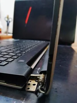 A close up side view revealing the snapped metal hinge bracket completely Stock Photos