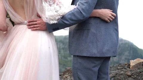 Close side view romantic touching. Newlyweds soft hug each other surroundedn by Stockbeeldmateriaal 101977300