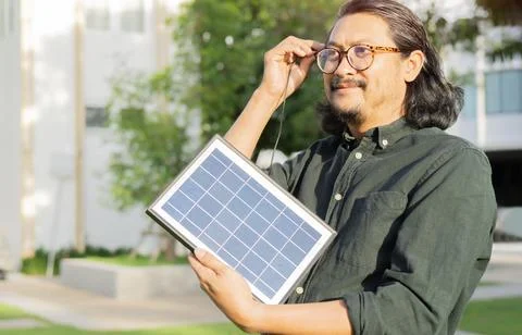 Close-up side view shot of active man with beard charging his energy by por.. Stock Photos