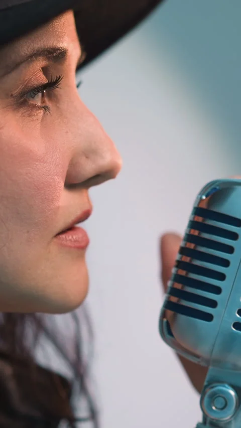 Close Side View of Singer in Black Hat with Vintage Microphone Stock Footage 310761820
