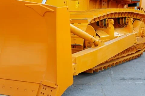 Close-up side view of a tracked heavy bulldozer Stock Photos
