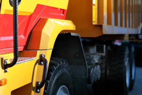 Close-up side view of a tri axle dump truck Stock Photos
