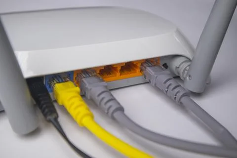 Close-up side view of a white wireless router back panel showing a black po.. Stock Photos