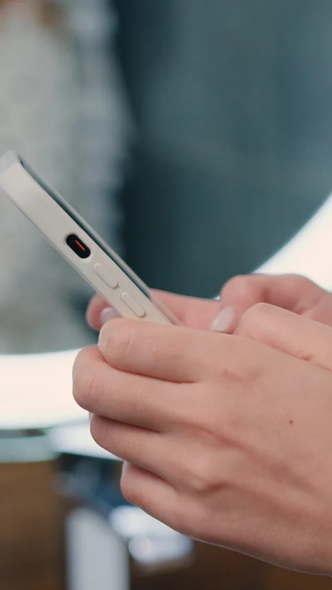 Close-up side view young female hands holding phone, girl typing message on mode Stock Footage 333330610