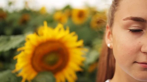 Close-up side of young person looking at camera. Shot of beautiful Caucasian Stock Footage 99704120