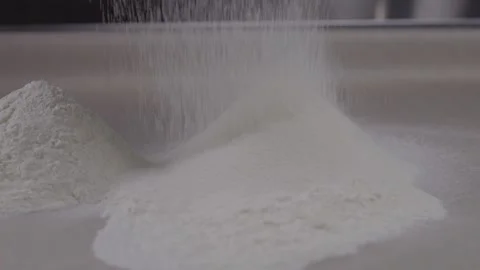 Close-up of sifting wheat flour through a sieve. Stock Footage 313972980
