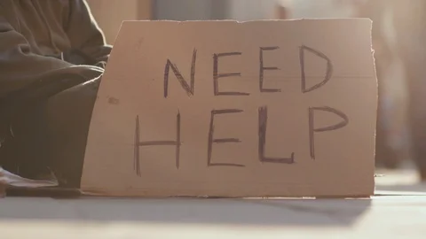 Close up sign homeless honeliness social cardboard homeless beggar face poverty Stock Footage