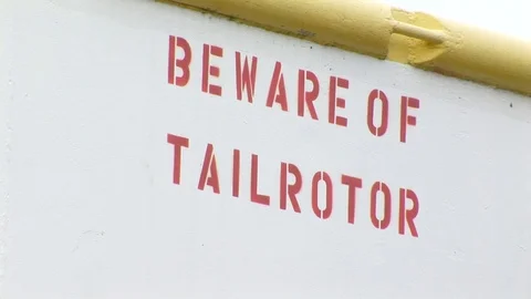 Close-up of signage on boat with message "Beware of tailrotor." Video stock 102188518