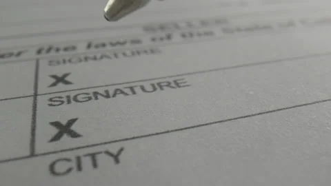 Close-up of signing a contract with a pen Stock Footage 134799445