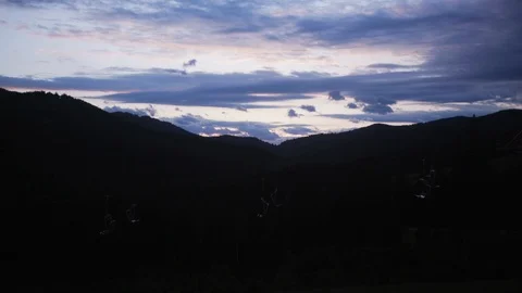 Close up silhouette of mountains at colored sunset landscape nature sun sunrise Stock Footage 113917393